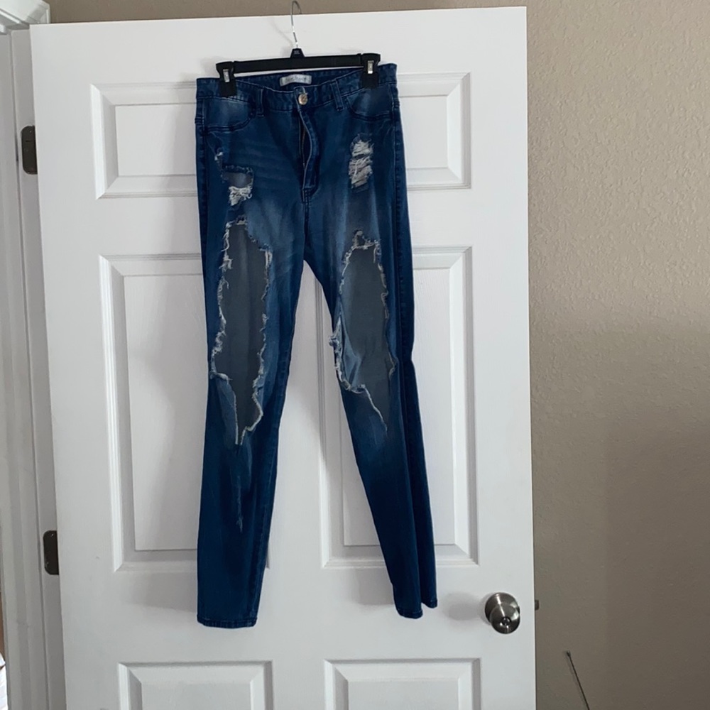 Extremely distressed size 11 jeans.